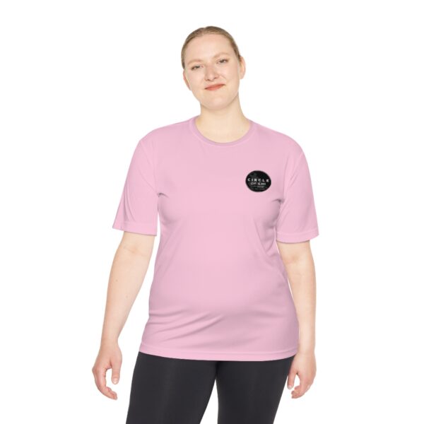 A person wearing a Circle of Chi Athletic Tee stands against a white background.