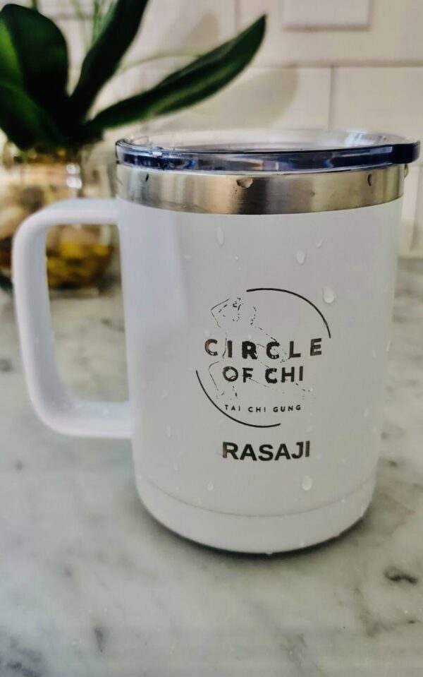 Circle of Chi Travel Mug 14oz with the logo "Circle of Chi Tai Chi Gung" and the name "Rasaji" printed on it, placed on a marble surface with droplets of water on its exterior.