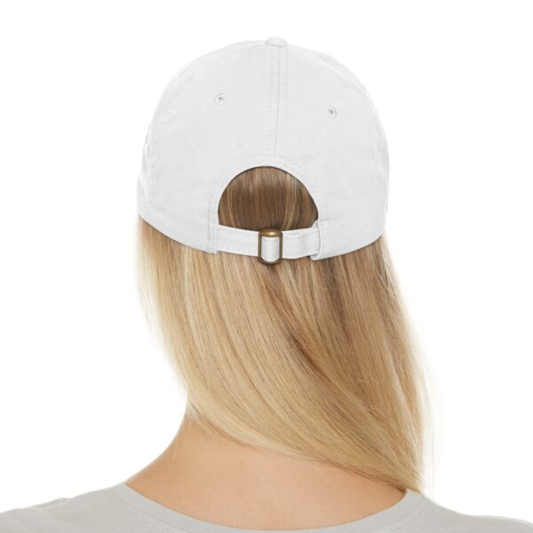 Rear view of a person with long blond hair wearing a Love Yourself Dad Hat with an adjustable strap.