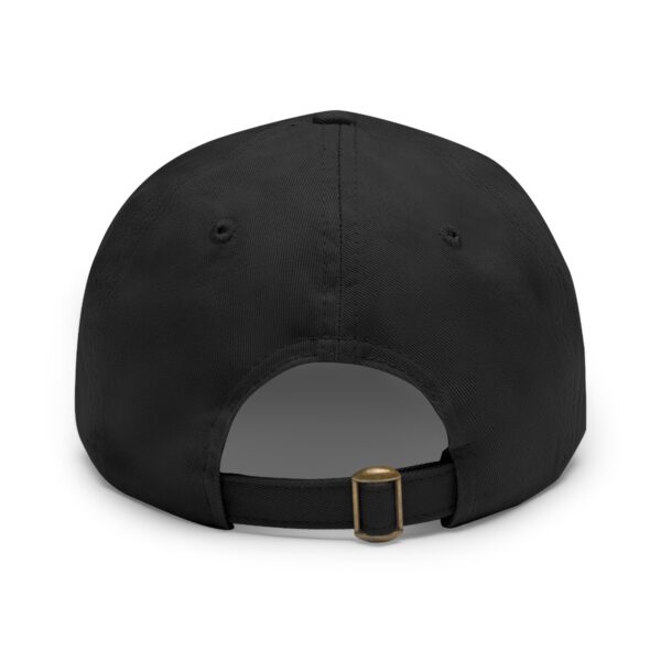 A Circle of Chi Dad Hat with Leather Patch shown from the rear with an adjustable strap and brass buckle.