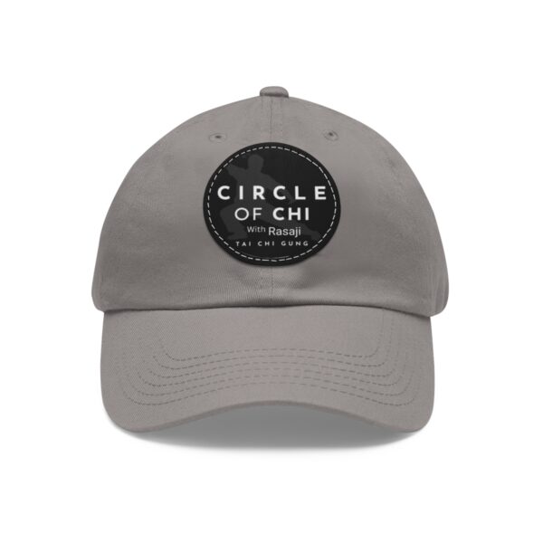 A gray Circle of Chi Dad Hat with Leather Patch that reads "Circle of Chi with Rasaji Tai Chi Gung.