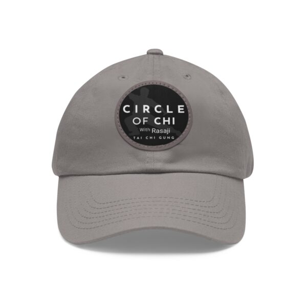 A Circle of Chi Dad Hat with Leather Patch featuring a black circular patch on the front with the text "CIRCLE OF CHI with Rasaji TAI CHI GUNG" in white letters.