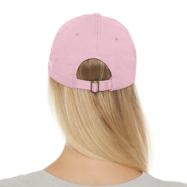 Back view of a person wearing a Circle of Chi Dad Hat with Leather Patch and long blonde hair.