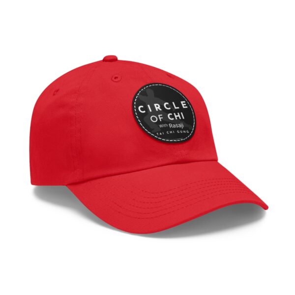 A red Circle of Chi Dad Hat with Leather Patch on the front reading "CIRCLE OF CHI with Rasaji TAI CHI GUNG.