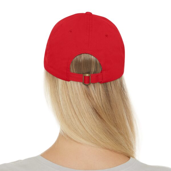 Back view of a person with long blonde hair wearing a Circle of Chi Dad Hat with Leather Patch.