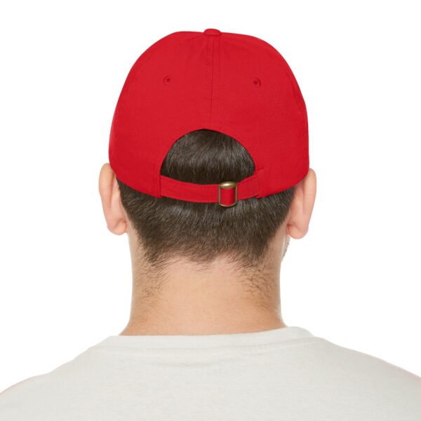 A person wearing a Circle of Chi Dad Hat with Leather Patch, viewed from the back. They are also wearing a white shirt.